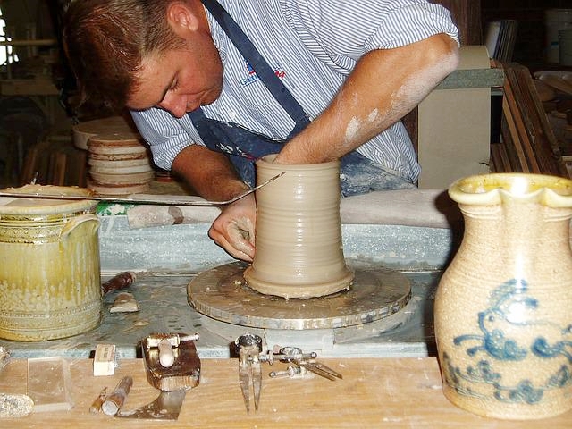Photo of worker making pottery
