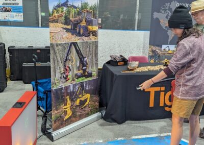Student putting out fire using a simulator at Tigercat Industries booth - Epic Jobs 2024