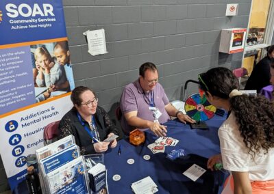 Students learn about SOAR Community Services at their booth - Epic Jobs 2024